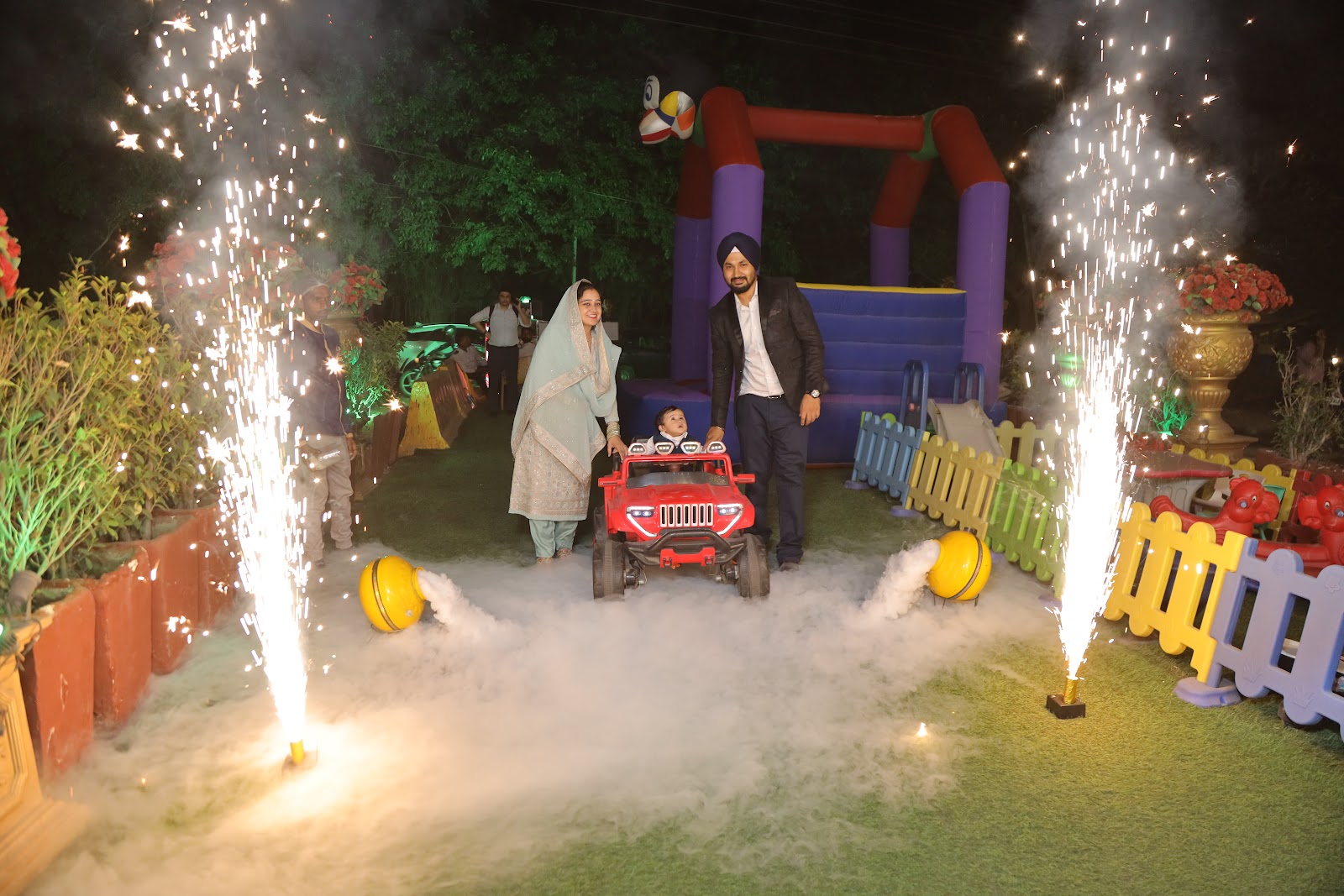 Wedding car surrounded by sparklers and fireworks