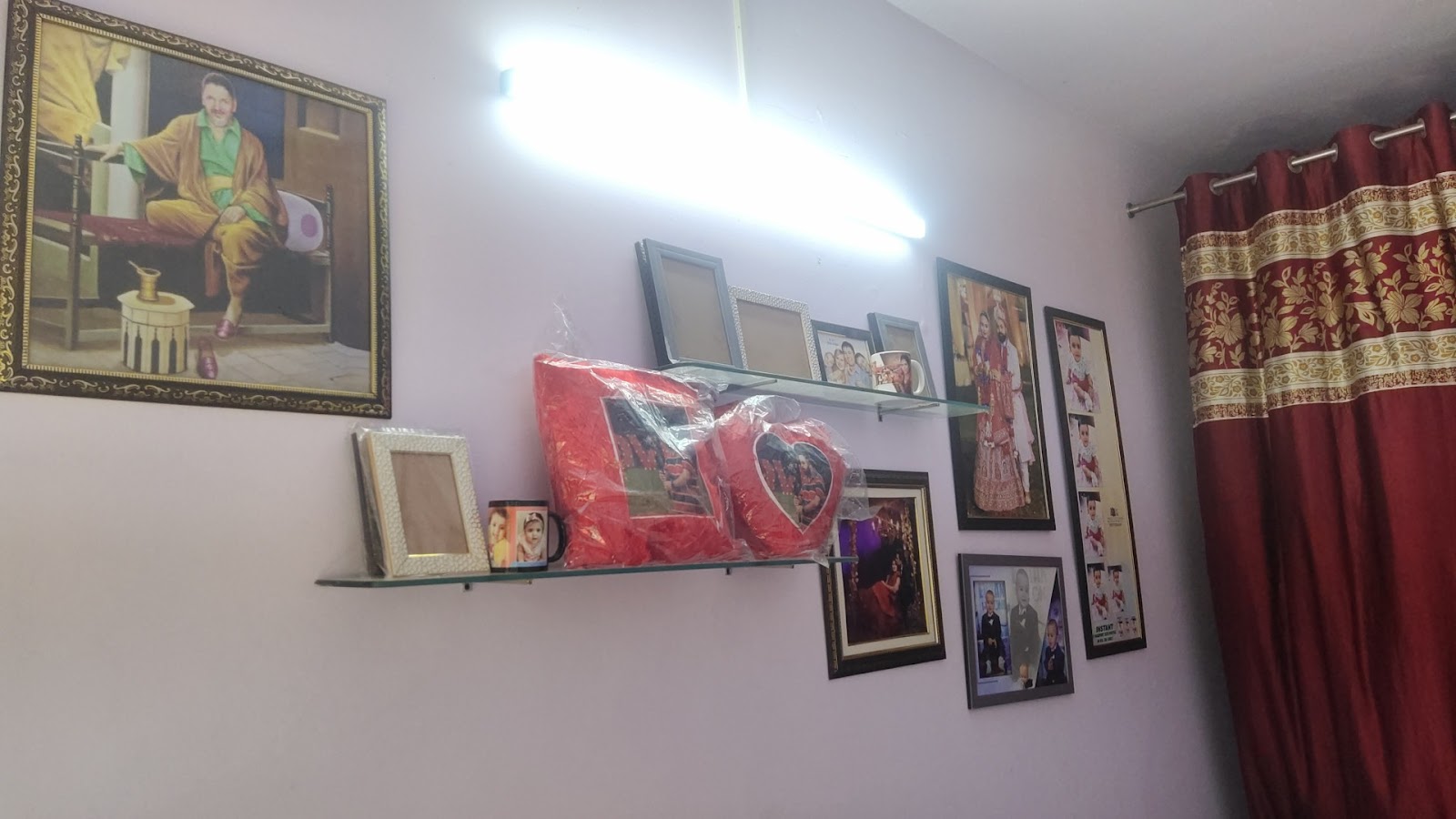 Wall of framed prints inside the studio