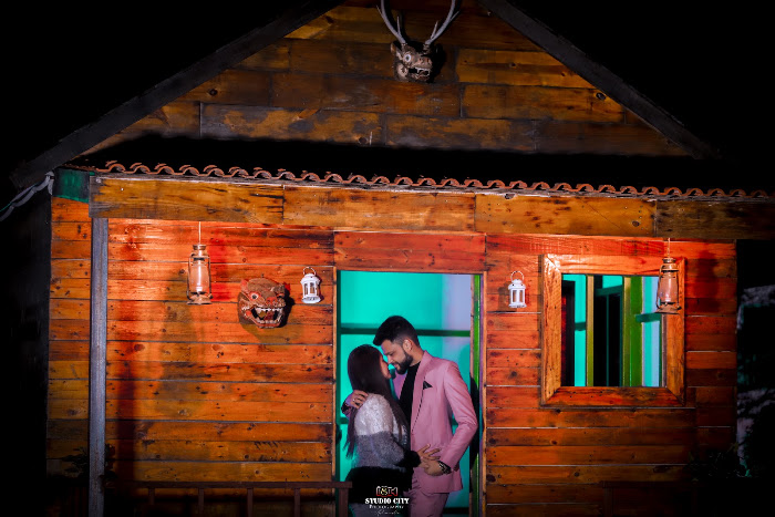 Through the window — pre-wedding photography by Studio City Photography, Delhi